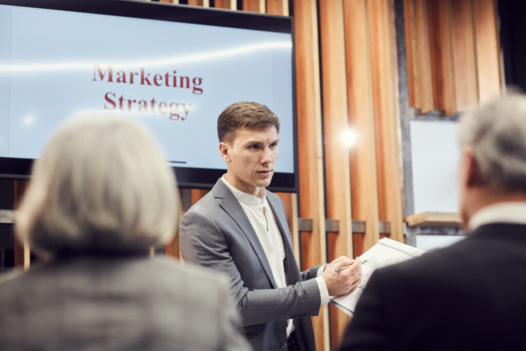 Sales professional implementing face-to-face marketing with his clients.